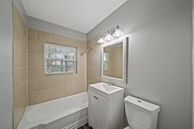 full bath with vanity, washtub / shower combination, and toilet