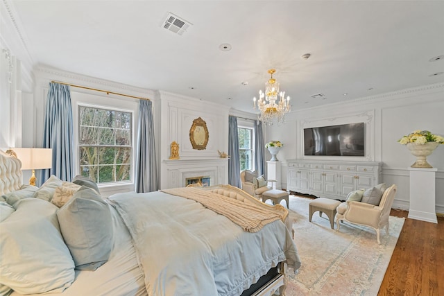 1069 Kirby Dr, Houston, TX 77019 - bedroom with an inviting chandelier, visible vents, ornamental molding, and multiple windows