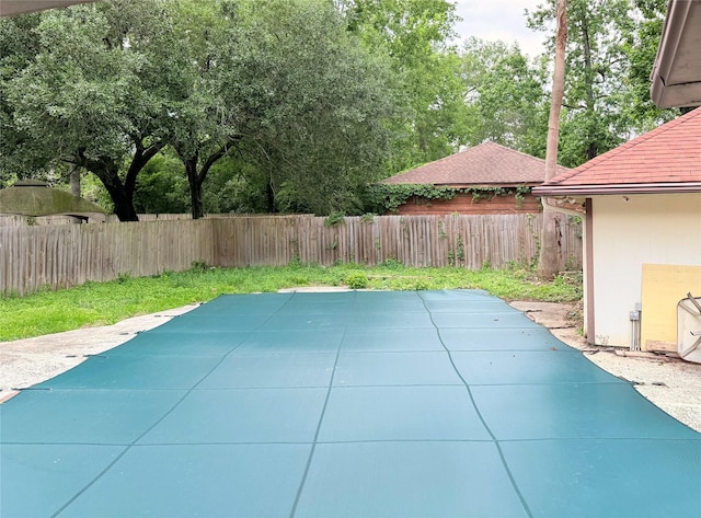 view of swimming pool featuring a patio and a fenced backyard