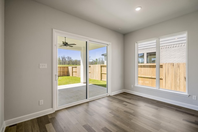 9722 Leafgate Ct, Missouri City, TX 77459 - doorway to outside featuring baseboards, recessed lighting, a healthy amount of sunlight, and dark wood-style flooring