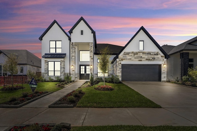 9722 Leafgate Ct, Missouri City, TX 77459 - view of front of house featuring a yard, stone siding, french doors, and a garage