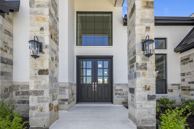 9722 Leafgate Ct, Missouri City, TX 77459 - property entrance featuring stone siding and french doors