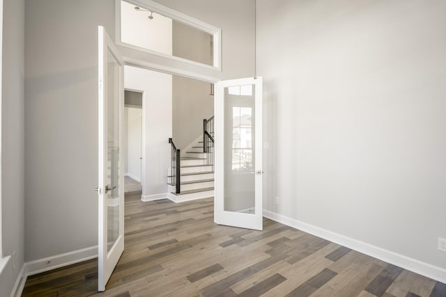 9722 Leafgate Ct, Missouri City, TX 77459 - entrance foyer with wood finished floors, french doors, and stairway