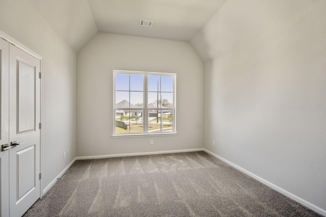 9722 Leafgate Ct, Missouri City, TX 77459 - spare room featuring baseboards, visible vents, carpet, and vaulted ceiling