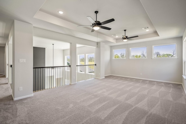 9722 Leafgate Ct, Missouri City, TX 77459 - empty room with a raised ceiling, ceiling fan, visible vents, and carpet floors