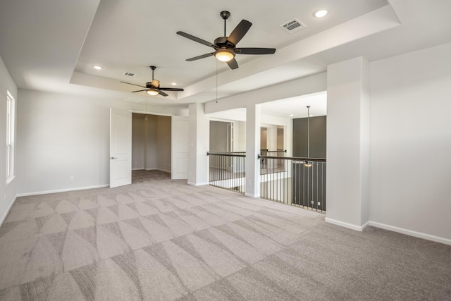 9722 Leafgate Ct, Missouri City, TX 77459 - spare room with recessed lighting, visible vents, a raised ceiling, and baseboards