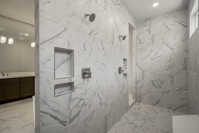 9722 Leafgate Ct, Missouri City, TX 77459 - bathroom with a marble finish shower, recessed lighting, marble finish floor, and vanity