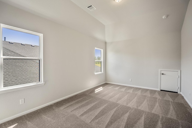 9722 Leafgate Ct, Missouri City, TX 77459 - unfurnished room with lofted ceiling, light colored carpet, visible vents, and baseboards