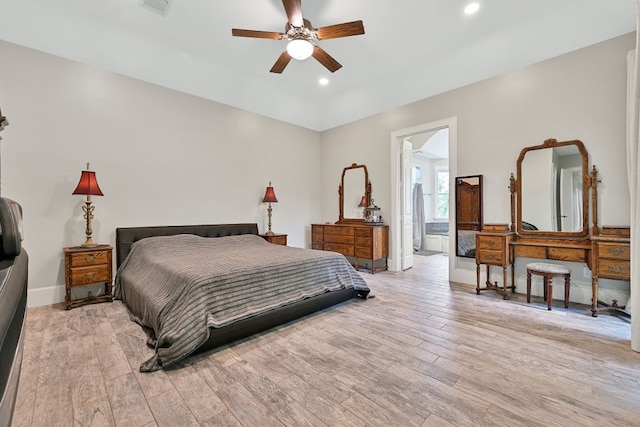 310 Rustic Ln, Friendswood, TX 77546 - bedroom featuring light wood-type flooring, recessed lighting, baseboards, ensuite bathroom, and a ceiling fan