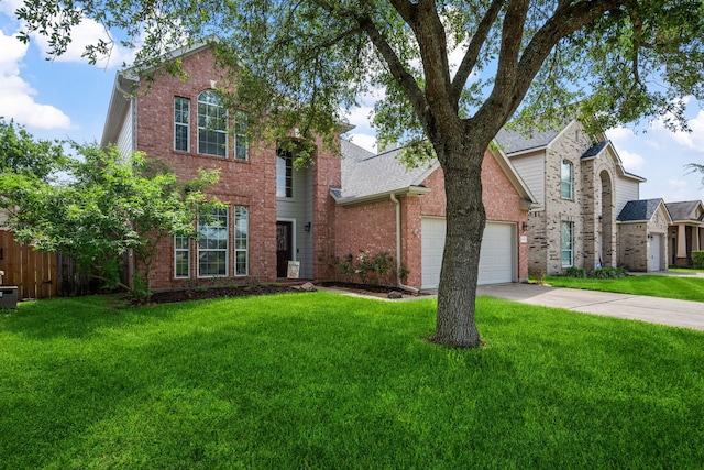 8522 E Highlands Xing, Highlands, TX 77562 - traditional-style house featuring driveway, a front lawn, brick siding, and a garage