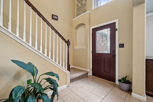 8522 E Highlands Xing, Highlands, TX 77562 - foyer with baseboards, stairway, a wealth of natural light, and tile patterned flooring