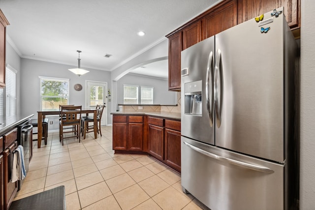 8522 E Highlands Xing, Highlands, TX 77562 - kitchen with light tile patterned floors, ornamental molding, stainless steel fridge, and plenty of natural light