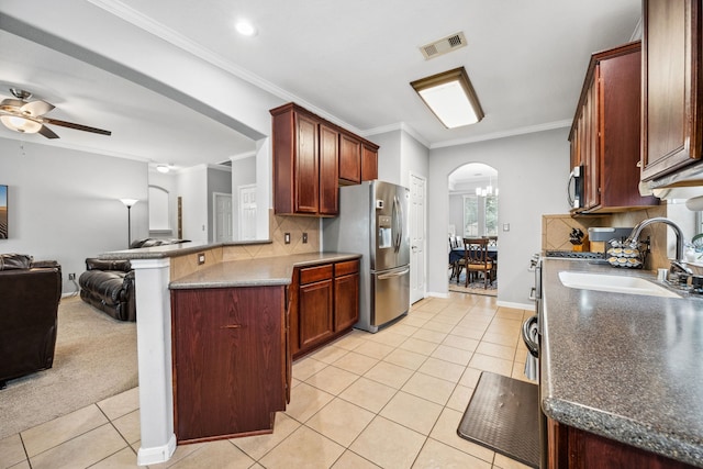 8522 E Highlands Xing, Highlands, TX 77562 - kitchen featuring light tile patterned flooring, a ceiling fan, visible vents, appliances with stainless steel finishes, and open floor plan