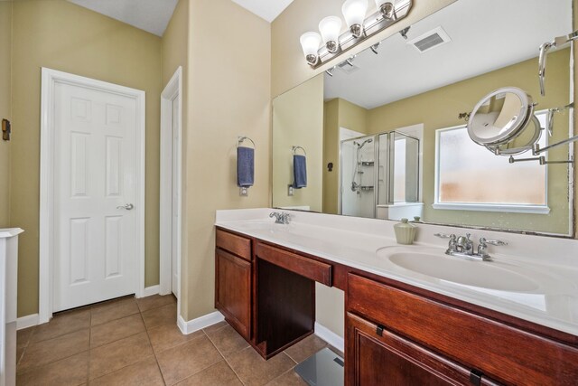 8522 E Highlands Xing, Highlands, TX 77562 - full bath featuring tile patterned floors, visible vents, a stall shower, and a sink