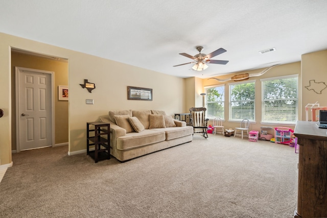 8522 E Highlands Xing, Highlands, TX 77562 - carpeted living room with ceiling fan, baseboards, and visible vents