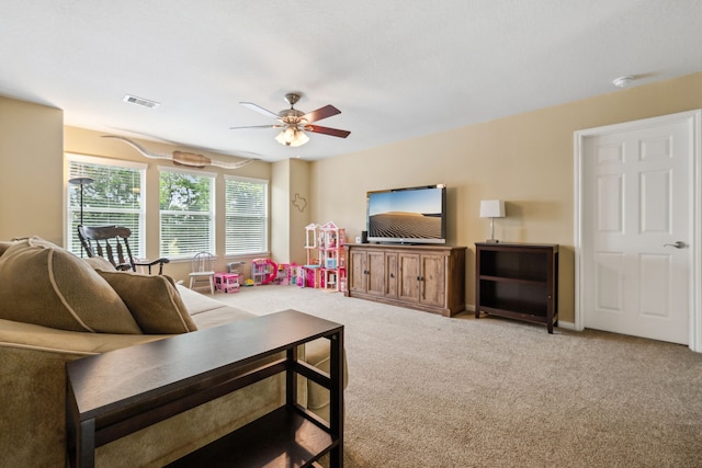 8522 E Highlands Xing, Highlands, TX 77562 - living area featuring visible vents, ceiling fan, and carpet flooring