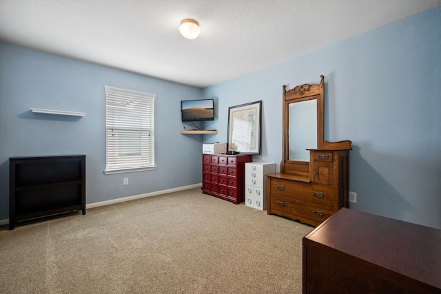 8522 E Highlands Xing, Highlands, TX 77562 - bedroom with baseboards and carpet flooring