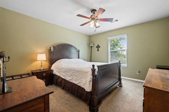 8522 E Highlands Xing, Highlands, TX 77562 - bedroom with baseboards, visible vents, light carpet, and ceiling fan