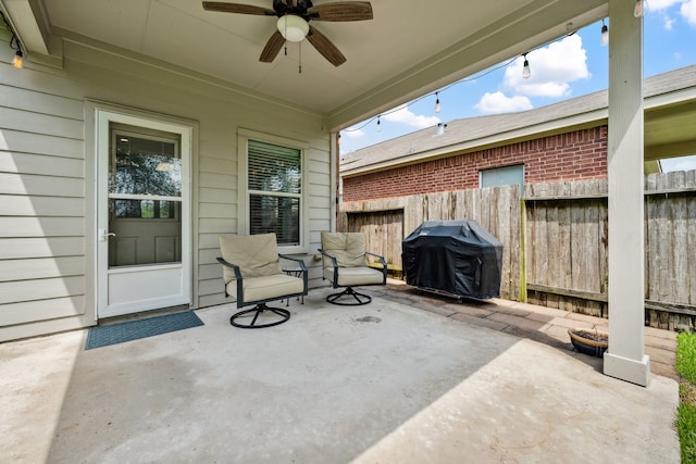 8522 E Highlands Xing, Highlands, TX 77562 - view of patio featuring fence, ceiling fan, and area for grilling