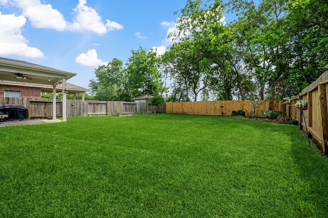 8522 E Highlands Xing, Highlands, TX 77562 - view of yard with a fenced backyard and a ceiling fan