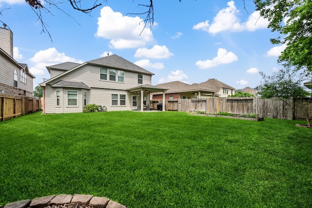 8522 E Highlands Xing, Highlands, TX 77562 - back of house with a yard, a patio, a shingled roof, and a fenced backyard