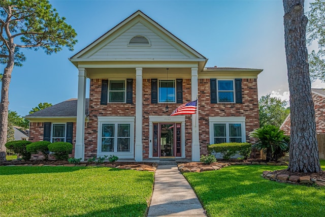 17022 Shadow Valley Dr, Spring, TX 77379 - neoclassical / greek revival house featuring brick siding and a front yard