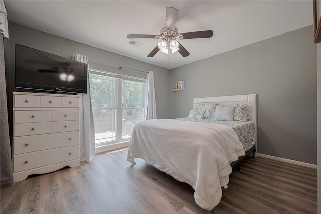17022 Shadow Valley Dr, Spring, TX 77379 - bedroom featuring wood finished floors, ceiling fan, and baseboards