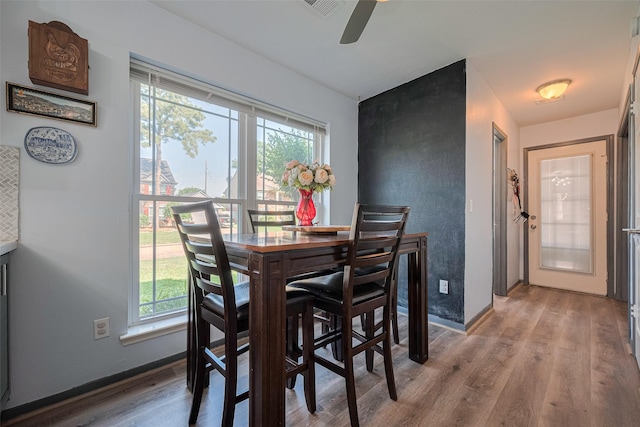 17022 Shadow Valley Dr, Spring, TX 77379 - dining space with wood finished floors, a ceiling fan, and baseboards
