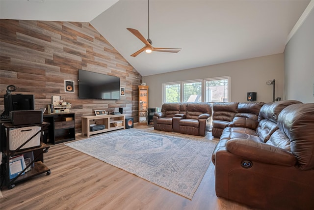 17022 Shadow Valley Dr, Spring, TX 77379 - living area with wooden walls, a ceiling fan, high vaulted ceiling, and wood finished floors