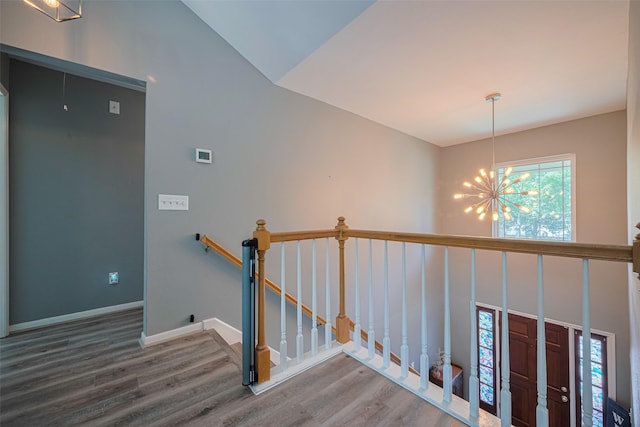 17022 Shadow Valley Dr, Spring, TX 77379 - staircase with a chandelier, wood finished floors, and baseboards