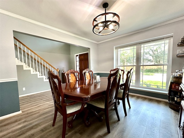 17022 Shadow Valley Dr, Spring, TX 77379 - dining space with a chandelier, dark wood-style floors, baseboards, ornamental molding, and stairway