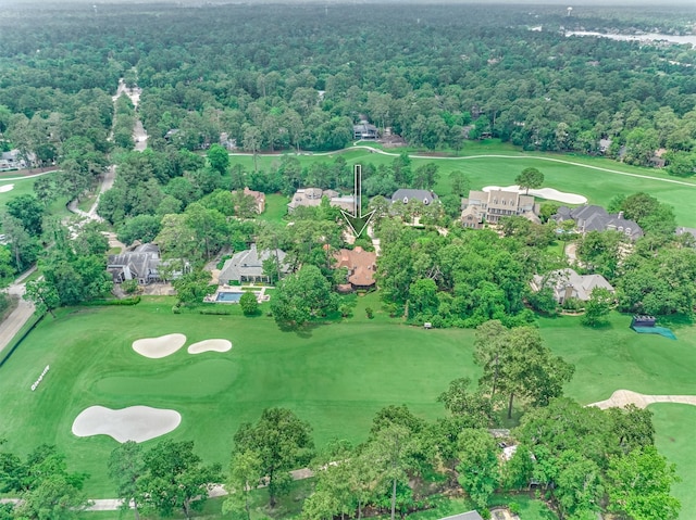 birds eye view of property featuring a view of trees and golf course view