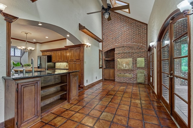 kitchen with brown cabinets, open shelves, a sink, ceiling fan with notable chandelier, and fridge with ice dispenser