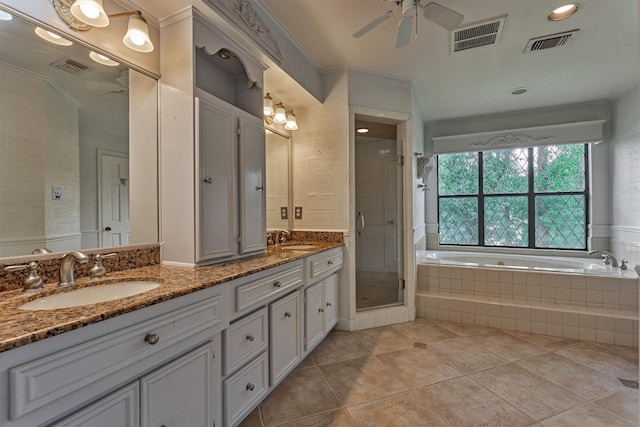 bathroom with a sink, ceiling fan, and visible vents