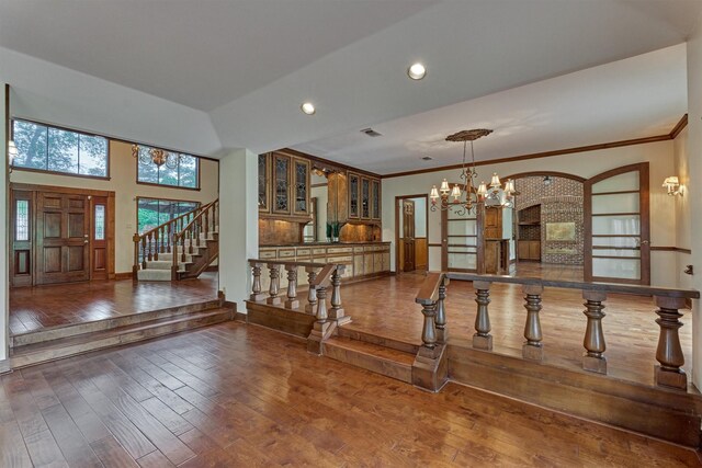 entryway featuring a chandelier, stairs, recessed lighting, visible vents, and hardwood / wood-style flooring
