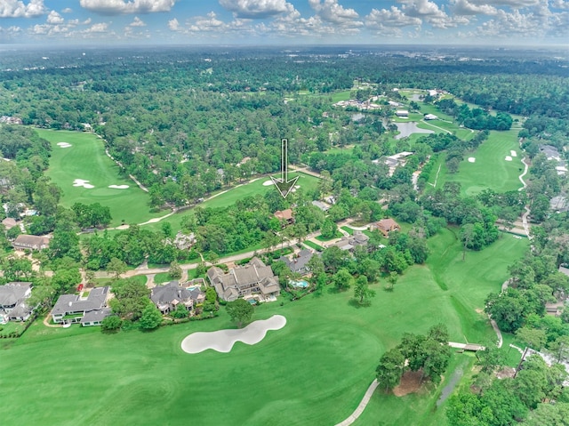 bird's eye view with a wooded view, golf course view, and a residential view