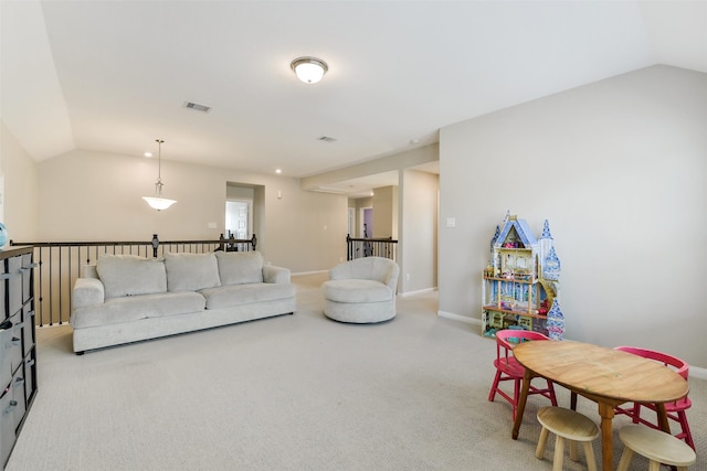 2379 Woodland Prairie Ln, Conroe, TX 77384 - carpeted living area with baseboards, visible vents, and lofted ceiling