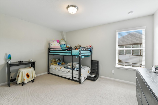 2379 Woodland Prairie Ln, Conroe, TX 77384 - bedroom with baseboards and light colored carpet