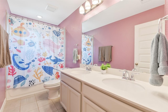 2379 Woodland Prairie Ln, Conroe, TX 77384 - full bath with toilet, double vanity, tile patterned floors, and a sink