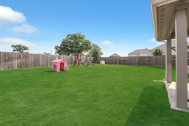 2379 Woodland Prairie Ln, Conroe, TX 77384 - view of yard with a fenced backyard and a playground