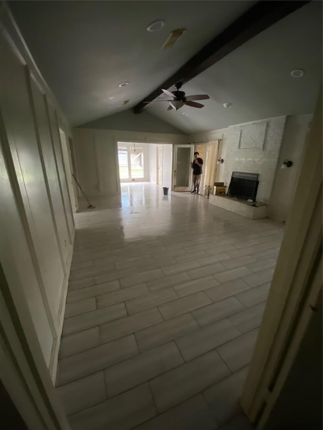 22006 Joshua Kendell Ln, Katy, TX 77449 - unfurnished living room with a fireplace and a ceiling fan