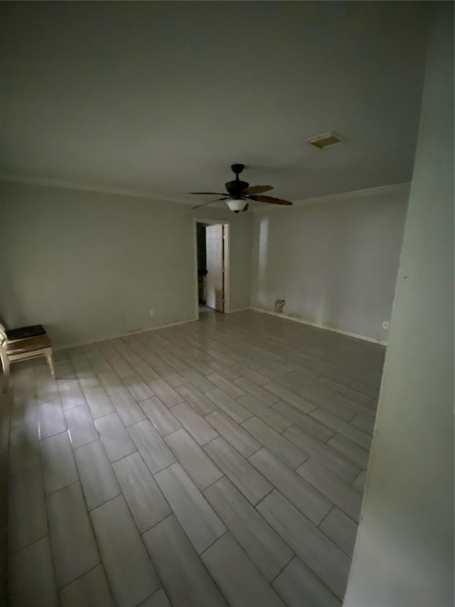 22006 Joshua Kendell Ln, Katy, TX 77449 - spare room featuring ornamental molding and a ceiling fan