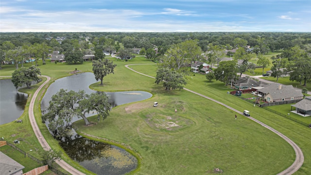 aerial view featuring a residential view, a water view, and view of golf course