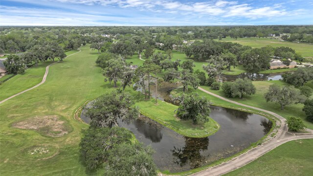 bird's eye view featuring a water view and golf course view