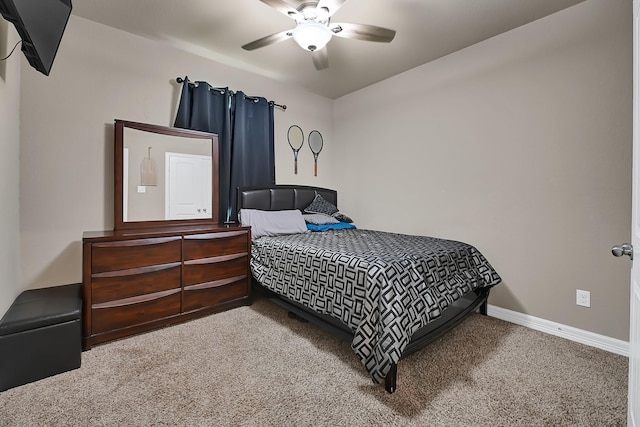 bedroom with ceiling fan, baseboards, and carpet floors
