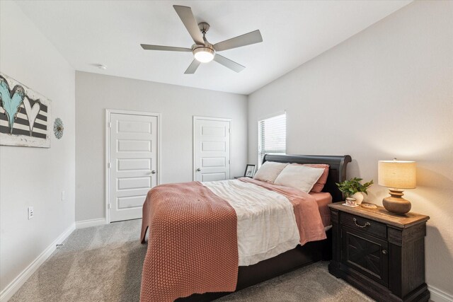 bedroom with baseboards, carpet, and a ceiling fan