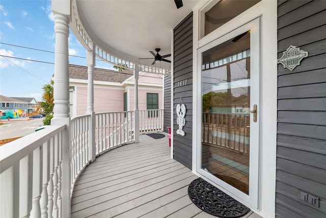 wooden terrace featuring a ceiling fan