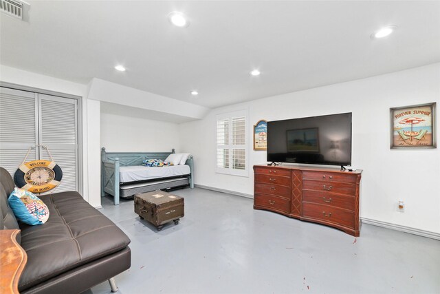 bedroom featuring visible vents, recessed lighting, and finished concrete floors