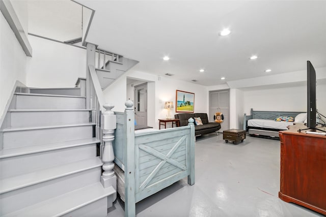 interior space with finished concrete flooring and recessed lighting