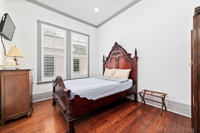 bedroom with ornamental molding, recessed lighting, baseboards, and wood-type flooring